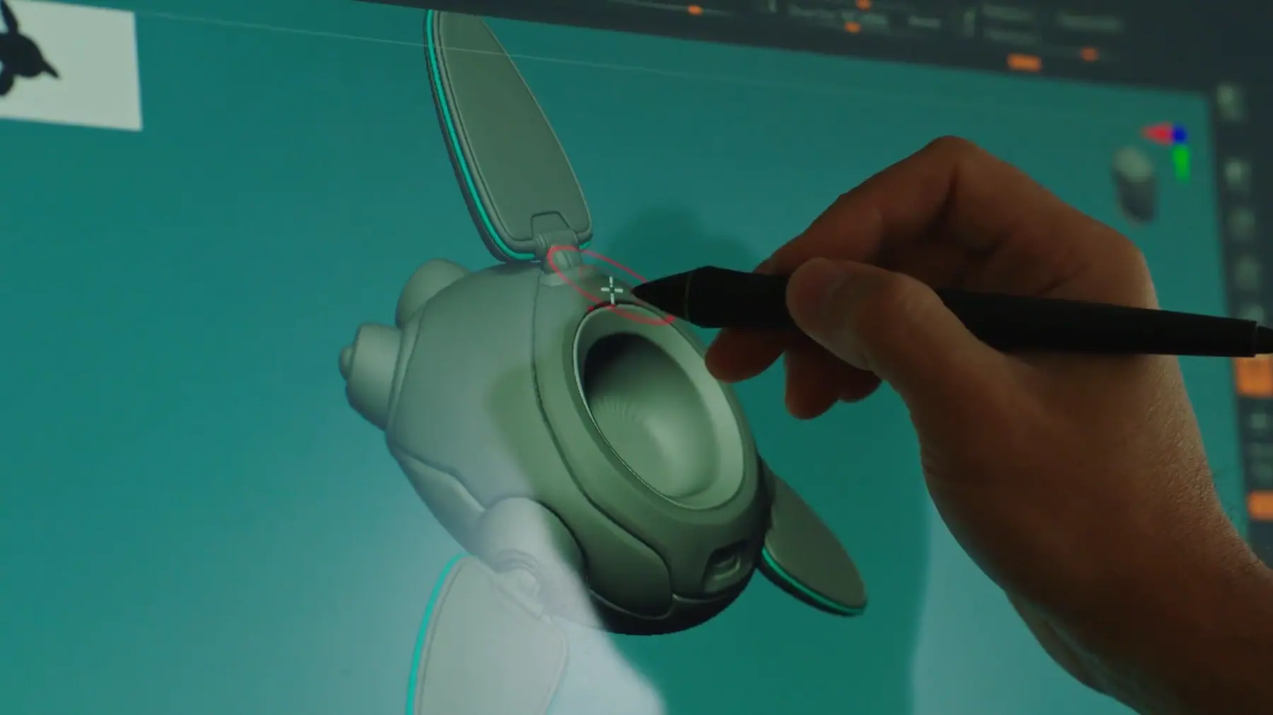 A designer sculpting a 3D model on screen